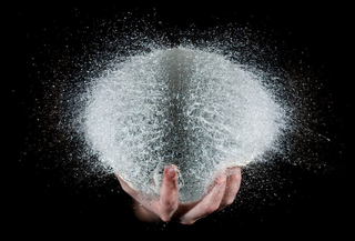 Illustration for article titled High-speed photographs capture water balloons the moment after they pop